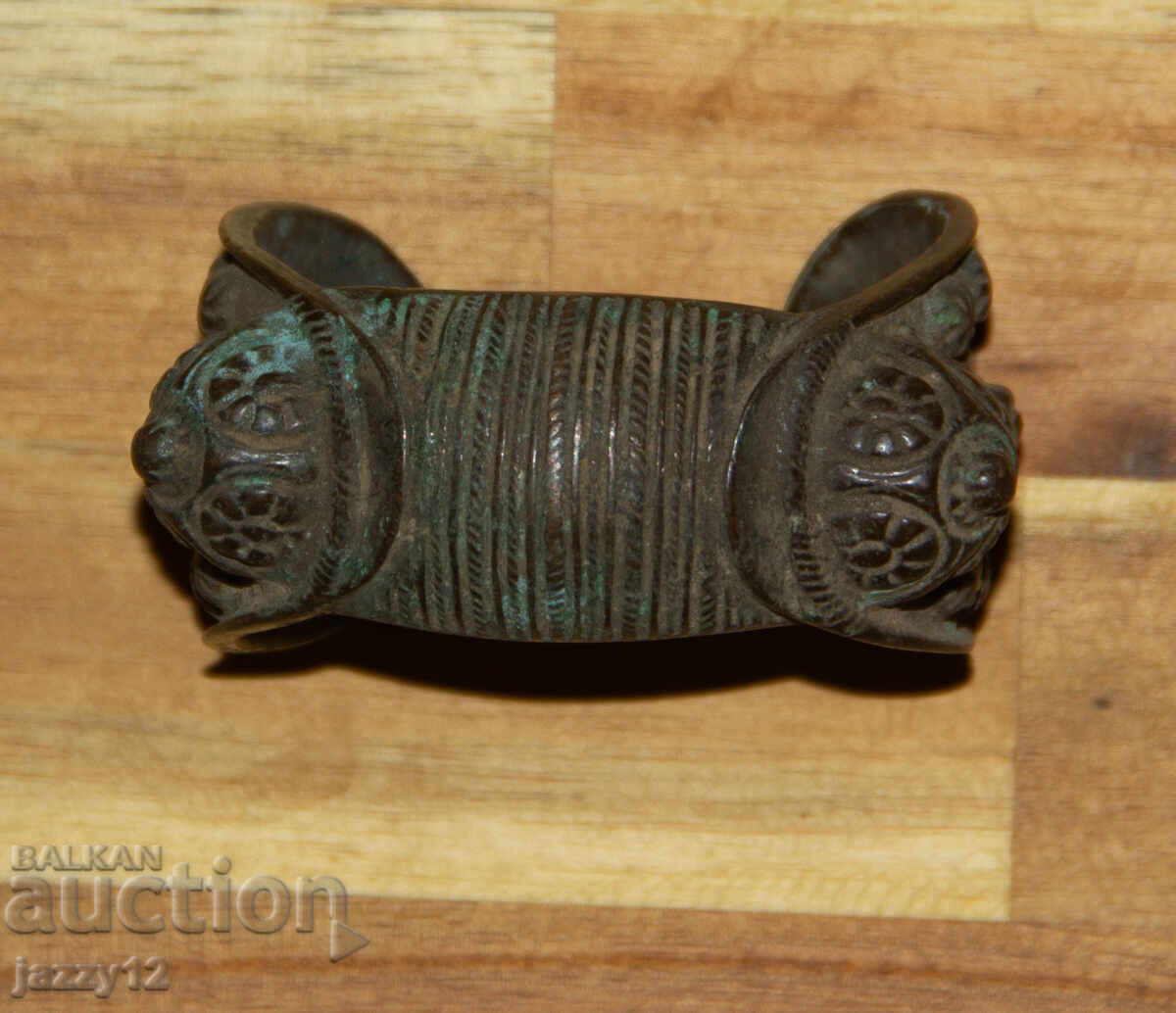 Auction  Old bronze slingshot bracelet