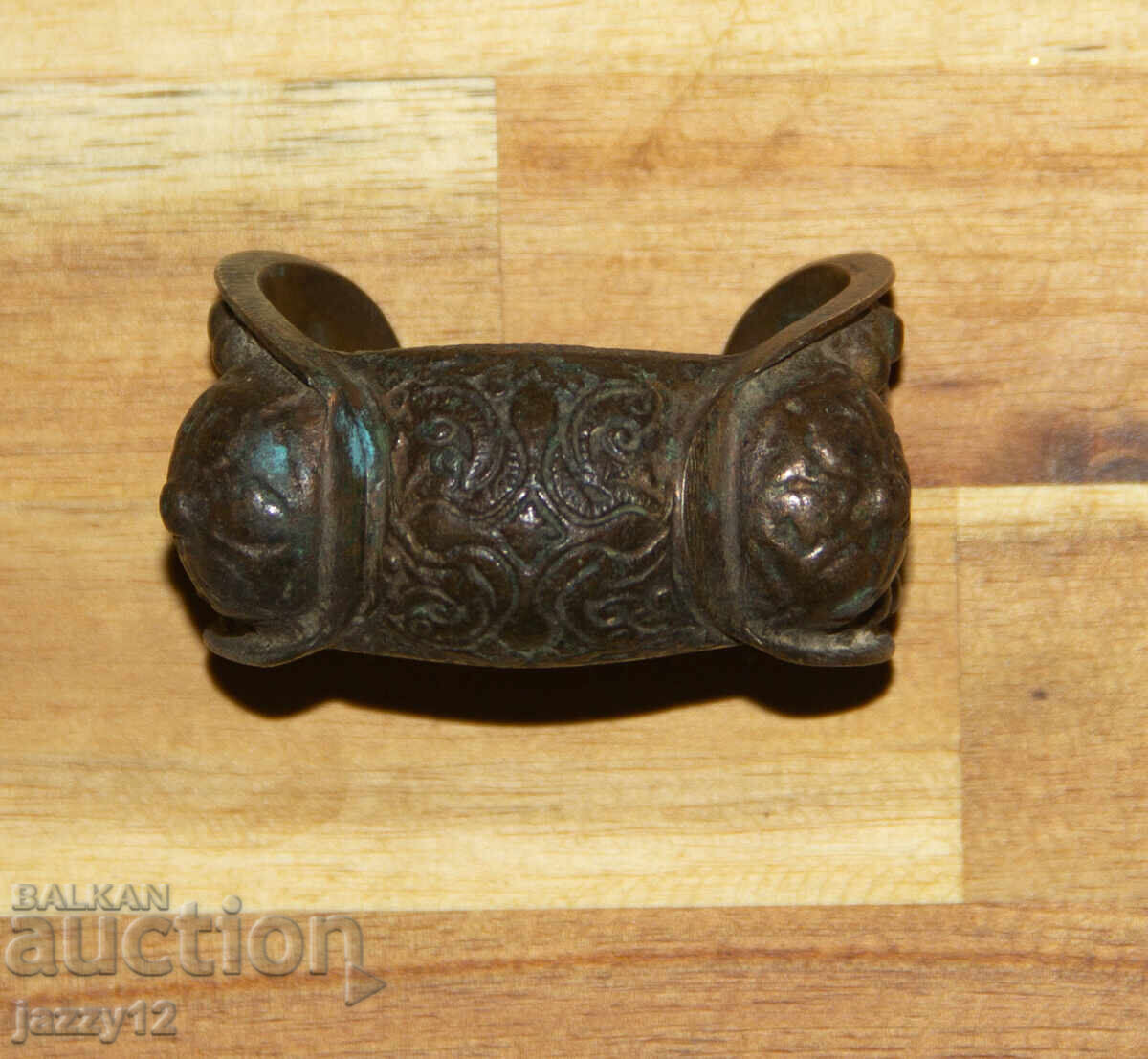 Old bronze bracelet slingshot with cross