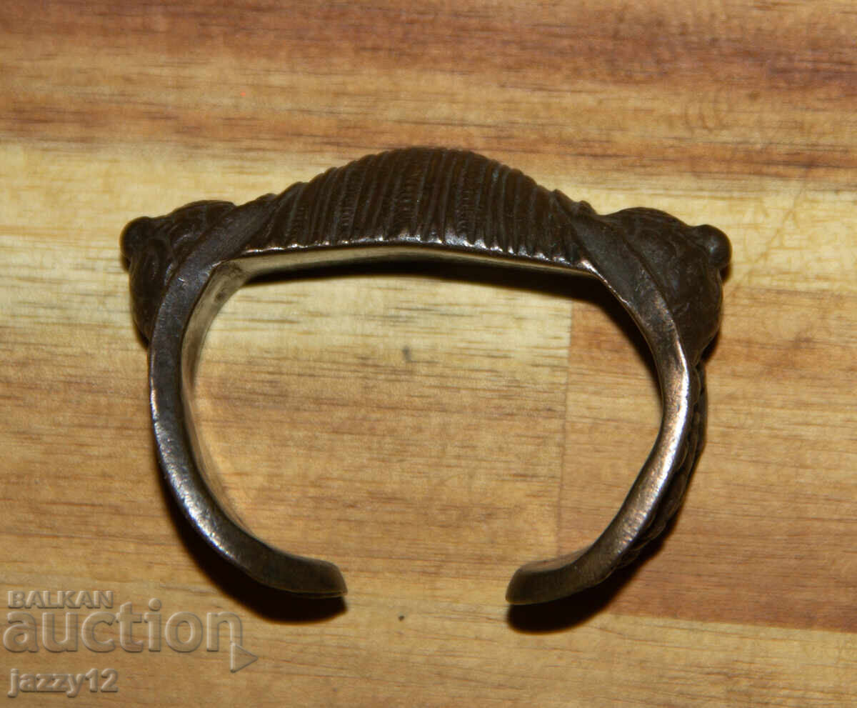 Auction  Old bronze slingshot bracelet