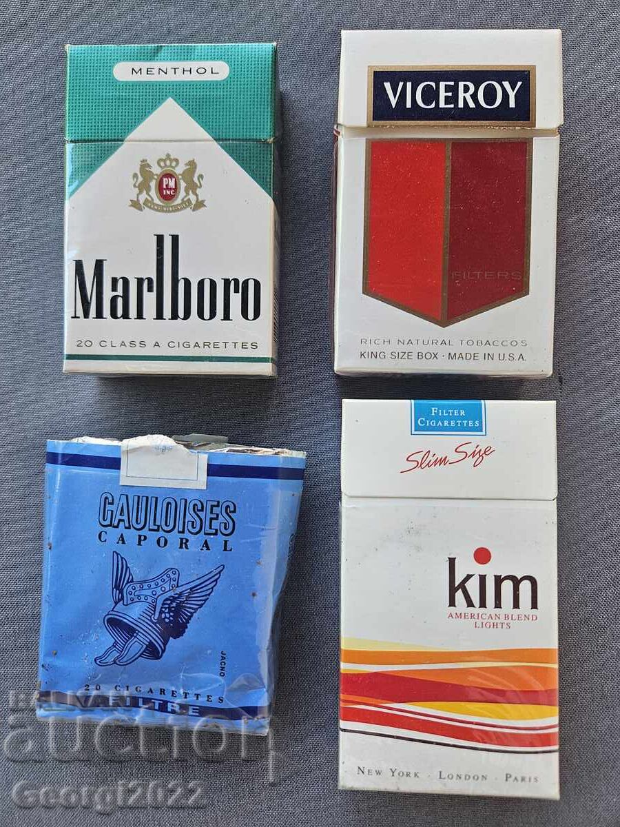 Empty cigarette boxes of Gauloises, Kim, Marlboro Empty cigarette boxes of Gauloises, Kim, Marlboro