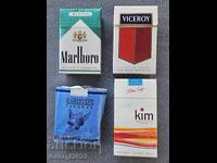 Empty cigarette boxes of Gauloises, Kim, Marlboro