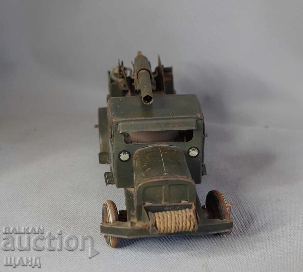 Типко 1930 Метална механична играчка Военен Камион Гаубица с цена 200.35 лв. | € 102.44 Типко 1930 Метална механична играчка Военен Камион Гаубица с цена 200.35 лв. | € 102.44