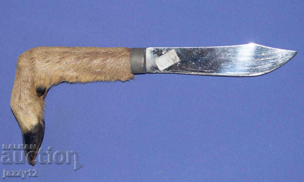 Solid hunting knife with a hoof handle
