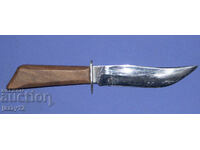 Solid hunting knife with a wooden handle