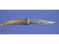 Solid hunting knife with a horn handle