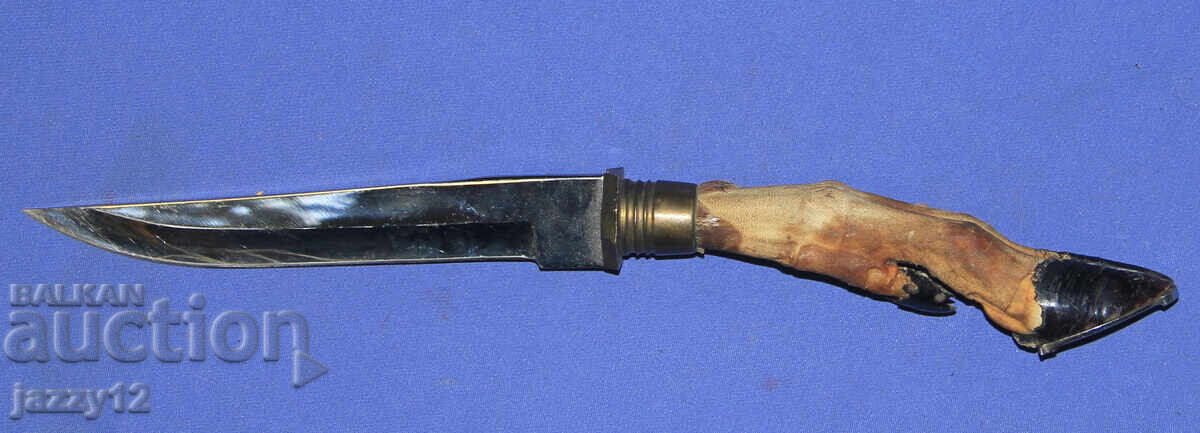 Solid hunting knife with a hoof handle