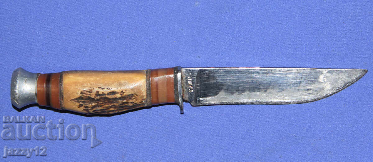 Tourist/hunting knife with a horn handle