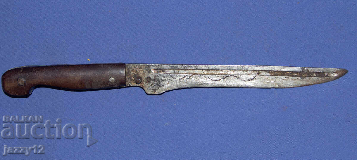 Old knife with ornaments and brass elements