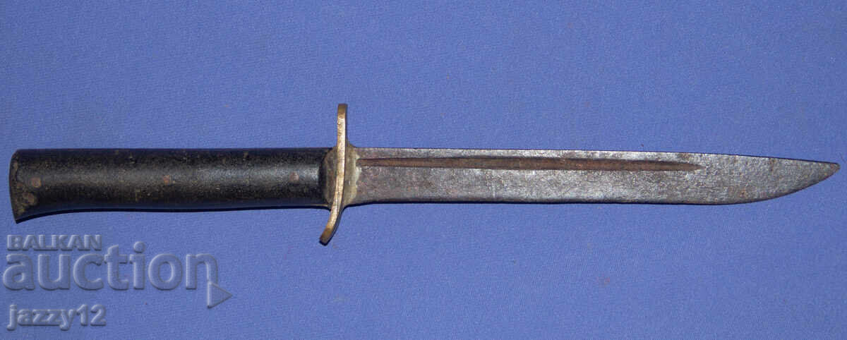 Old knife with brass elements