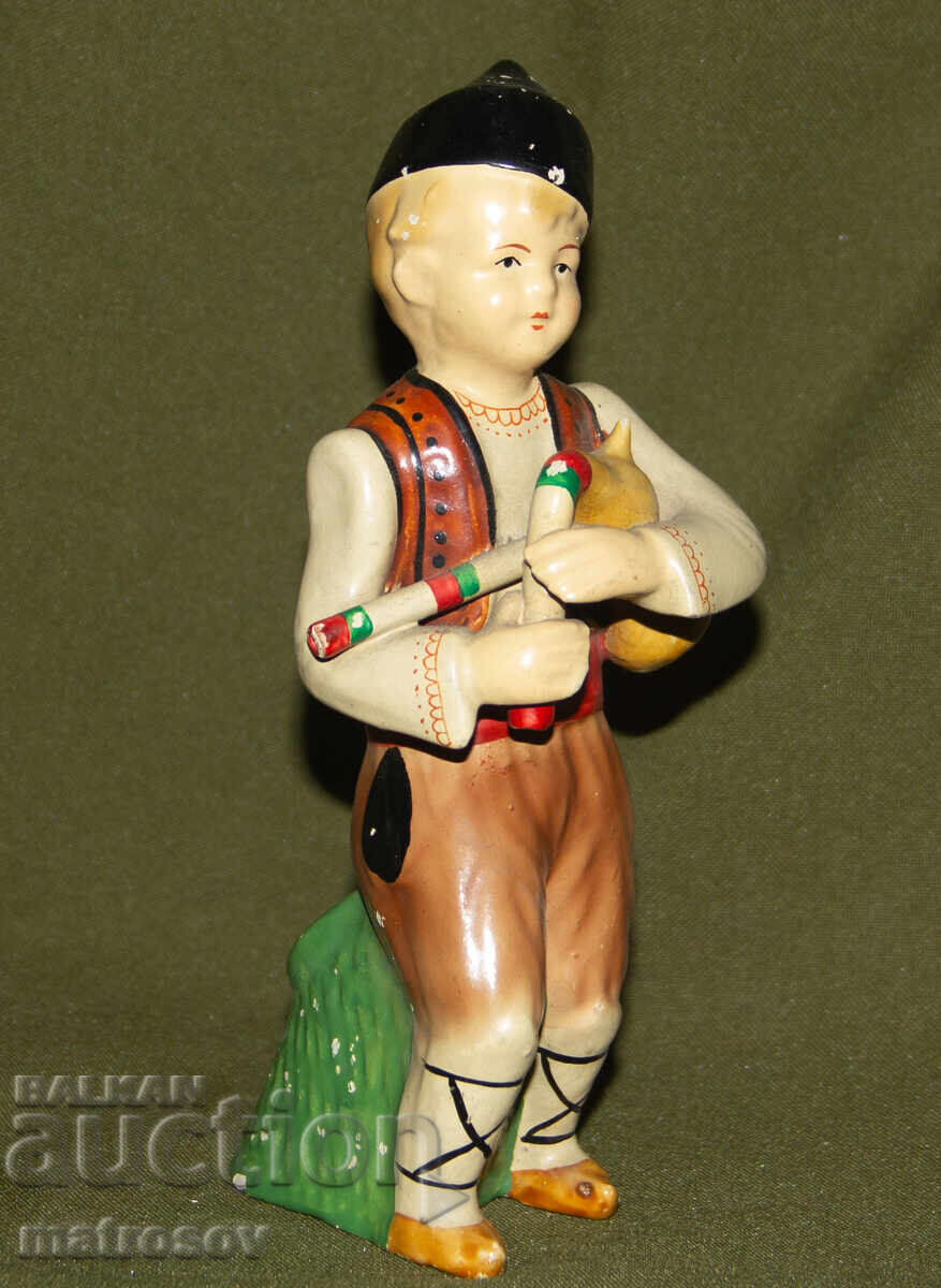 Decorative porcelain figurine, bagpiper with price 120.00 BGN | € 61.36