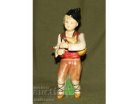 Figurină decorativă din porțelan, cântăreț la cimpoi