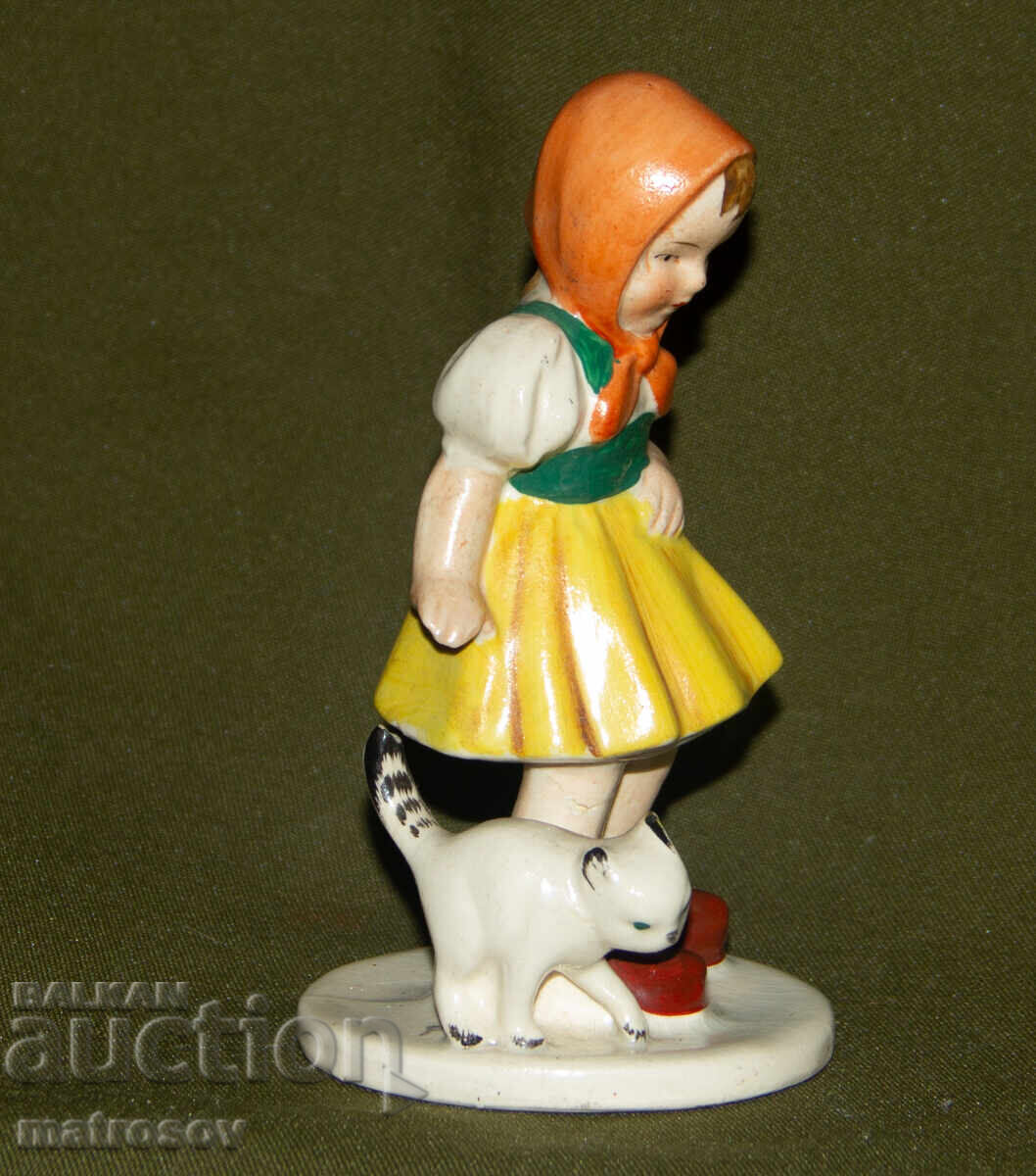 Auction  Old porcelain figurine of a girl with a cat