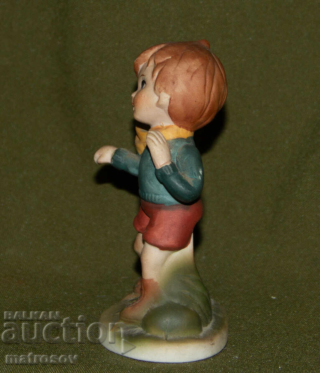 Auction  Old porcelain figurine, child on skates