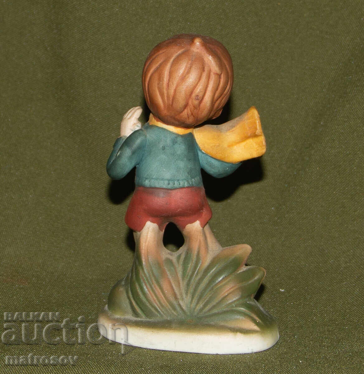 Delivery of Old porcelain figurine, child on skates