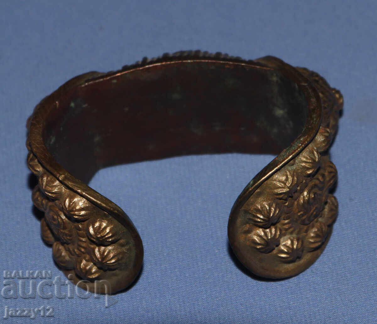Delivery of Old bronze bracelet slingshot with cross