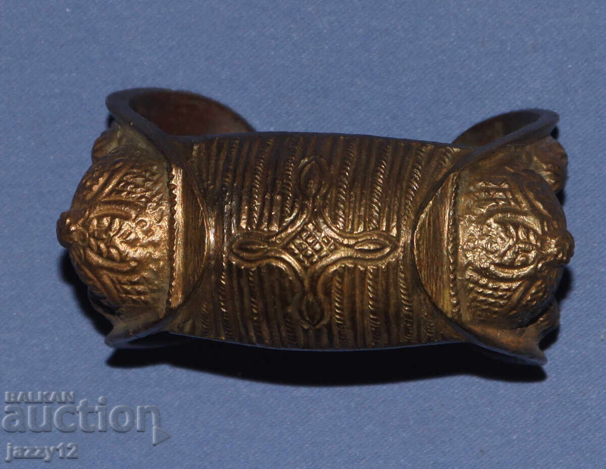 Old bronze bracelet slingshot with cross