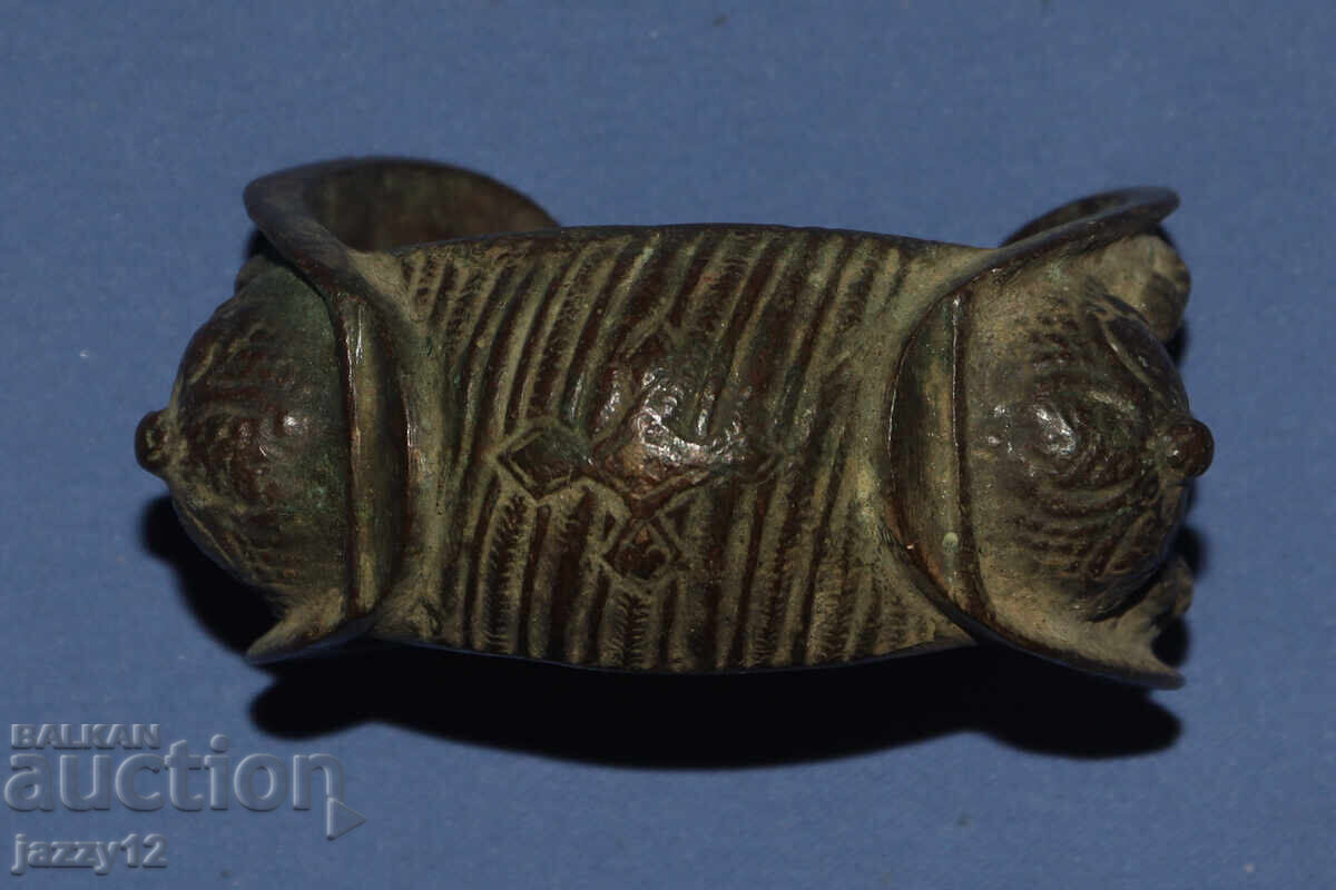 Old bronze bracelet slingshot with cross Old bronze bracelet slingshot with cross