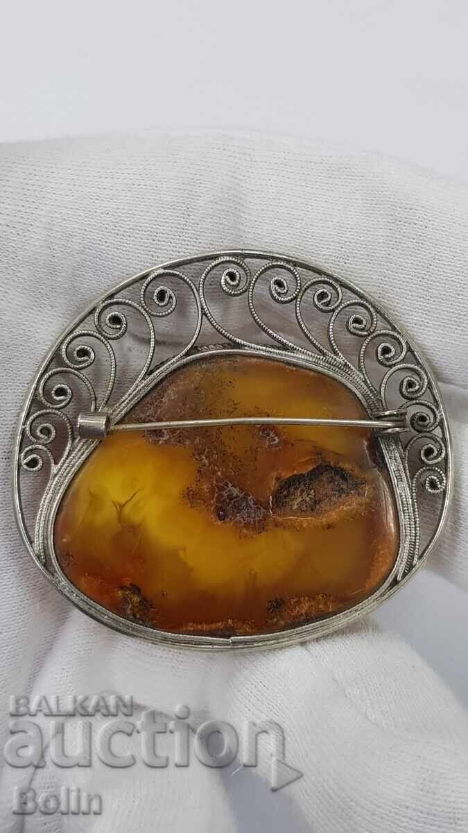 Delivery of Beautiful old brooch with a huge natural amber piece, Europe