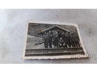 Photo of Soldiers and Two Young Girls with Rifles with Bayonets
