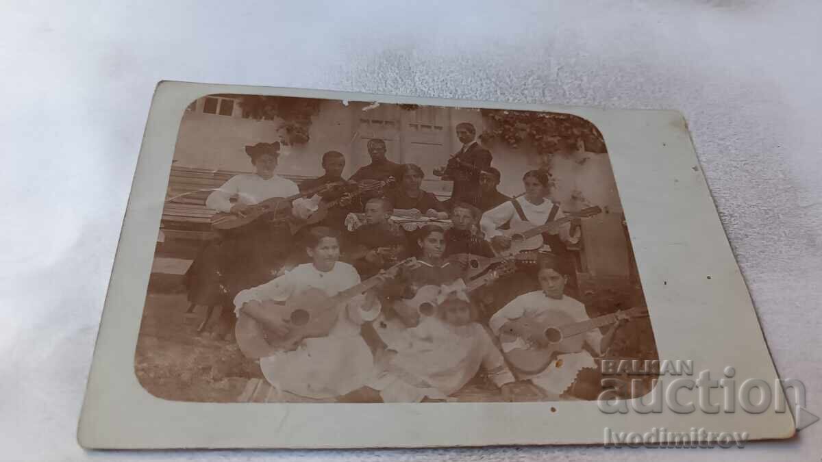 Photo of Girls and Boys with Tambourines and Guitars