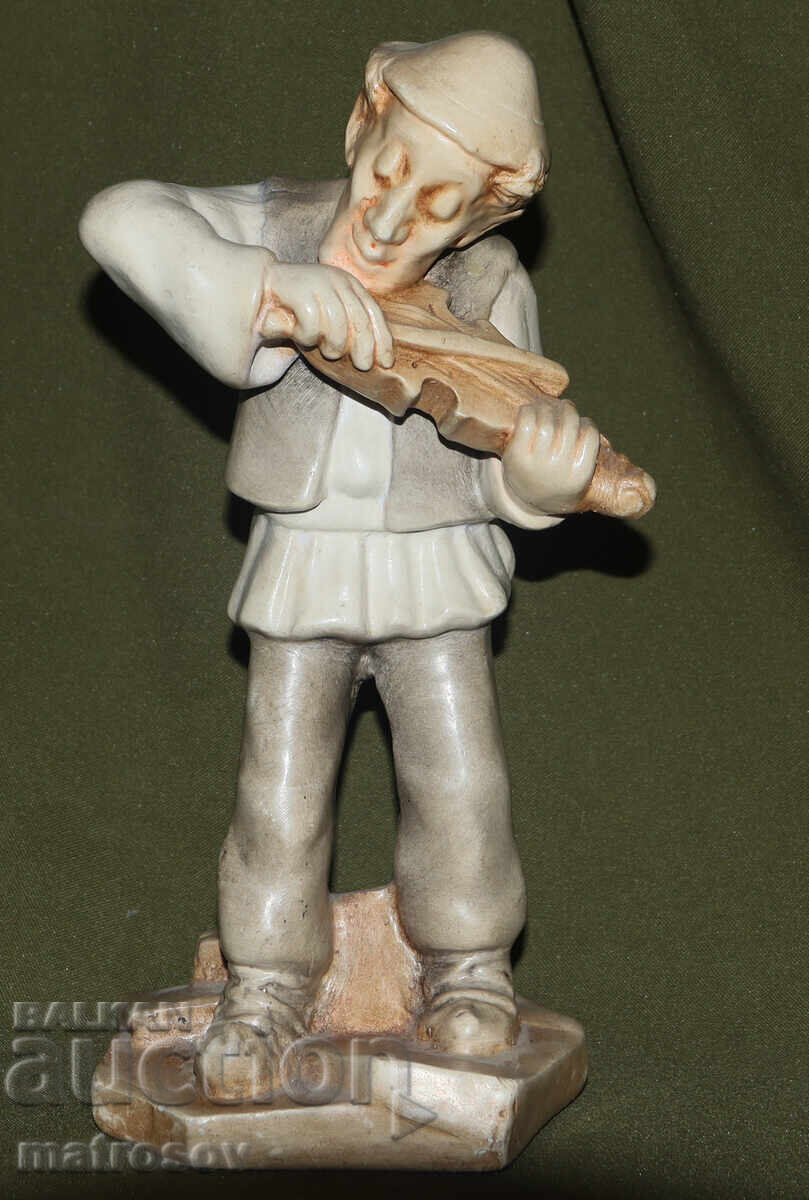 Decorative ceramic figurine of a musician, violinist