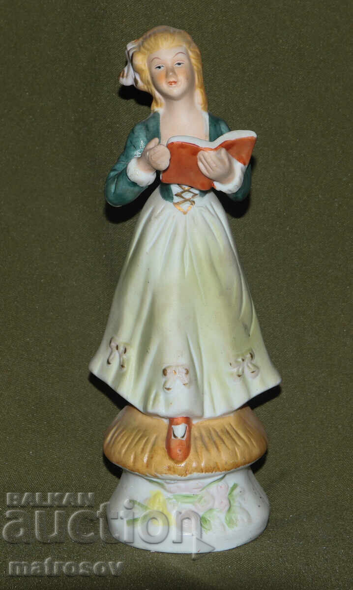 Πορσελάνινο ειδώλιο κοριτσιού με βιβλίο