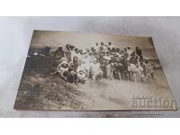 Φωτογραφία Γυναικών, κοριτσιών και αγοριών στην παραλία