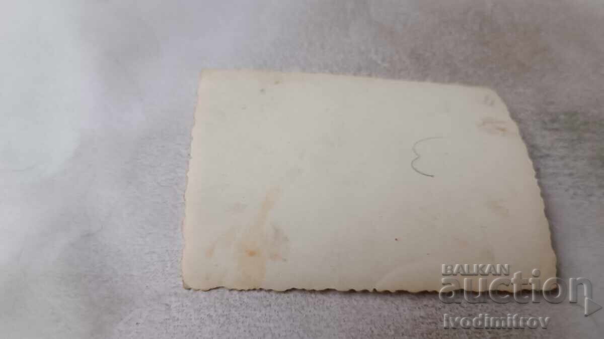 Photo of a woman climbing on a rock in winter with price 1.45 BGN | € 0.74