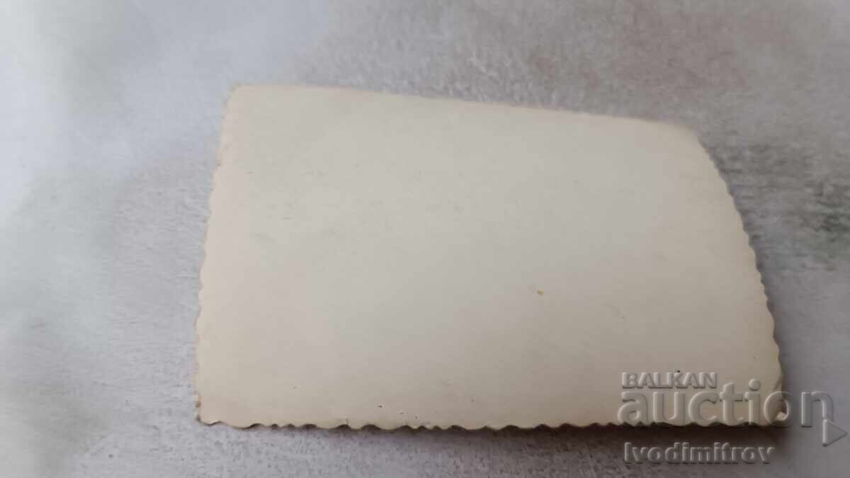 Photo: Men sitting around a table, having a drink with price 2.15 BGN | € 1.10