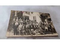 Photograph Men and women in front of an administrative building 1945