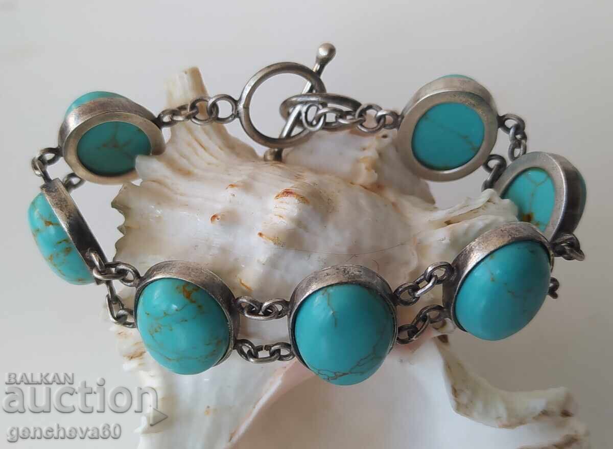 Old massive silver bracelet with turquoise