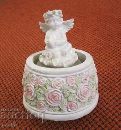 Angel figurine in a music box Angel figurine in a music box