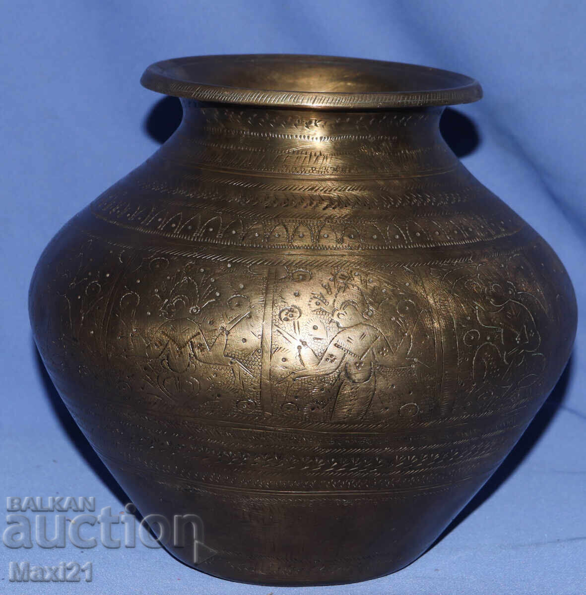 Old brass vase with figural motifs