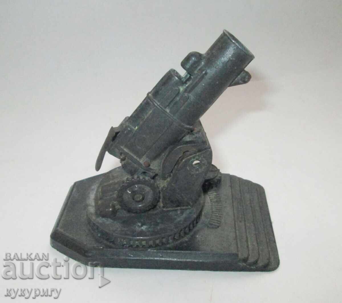 Old French military toy cannon model with a spring
