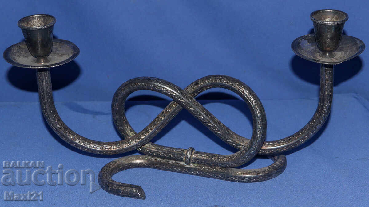 Auction  Interesting decorative metal candlestick