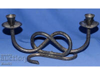 Интересен декоративен метален свещник