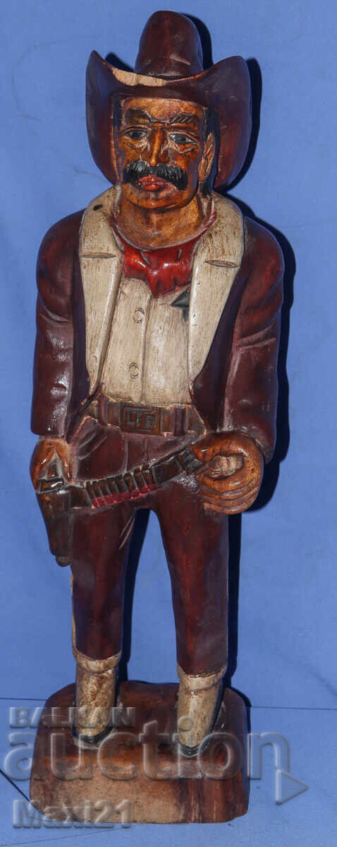 Old wood carving sculpture cowboy