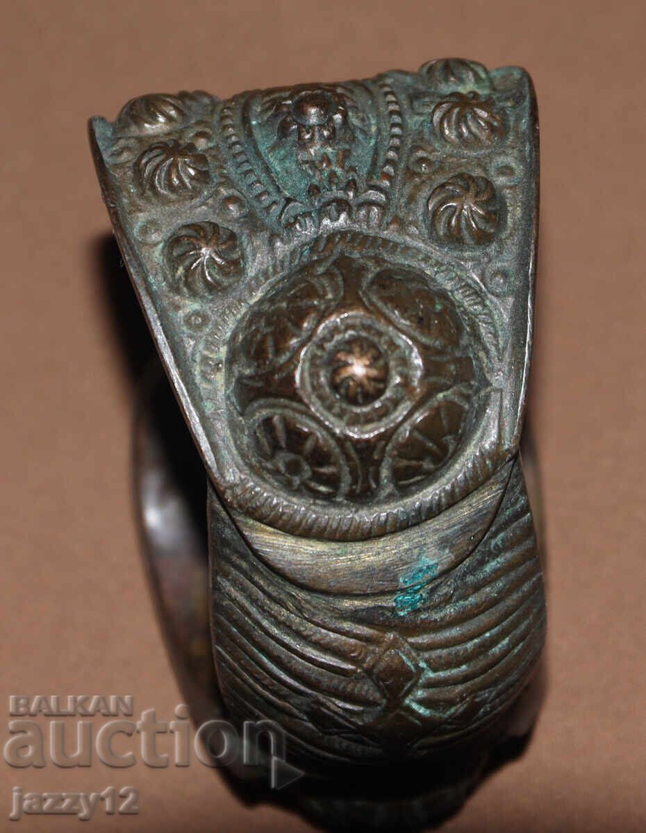 Delivery of Old bronze bracelet slingshot with cross