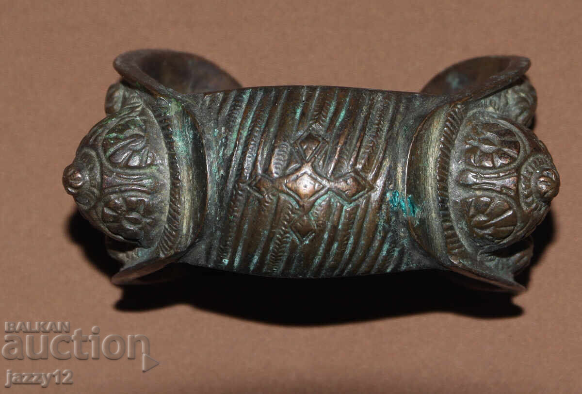 Old bronze bracelet slingshot with cross