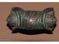 Brățară veche de bronz, tip praștie, cu cruce