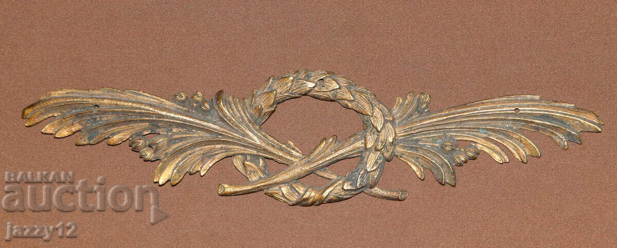 Αρχαία μπρούτζινη απλίκα με φλοράλ μοτίβα Αρχαία μπρούτζινη απλίκα με φλοράλ μοτίβα