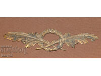 Aplicație veche din bronz cu motive florale