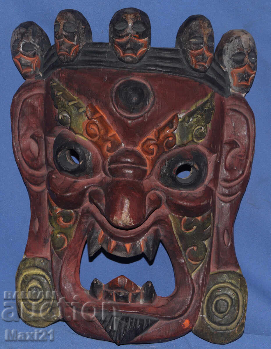 Auction  Hand-carved wooden panel mask