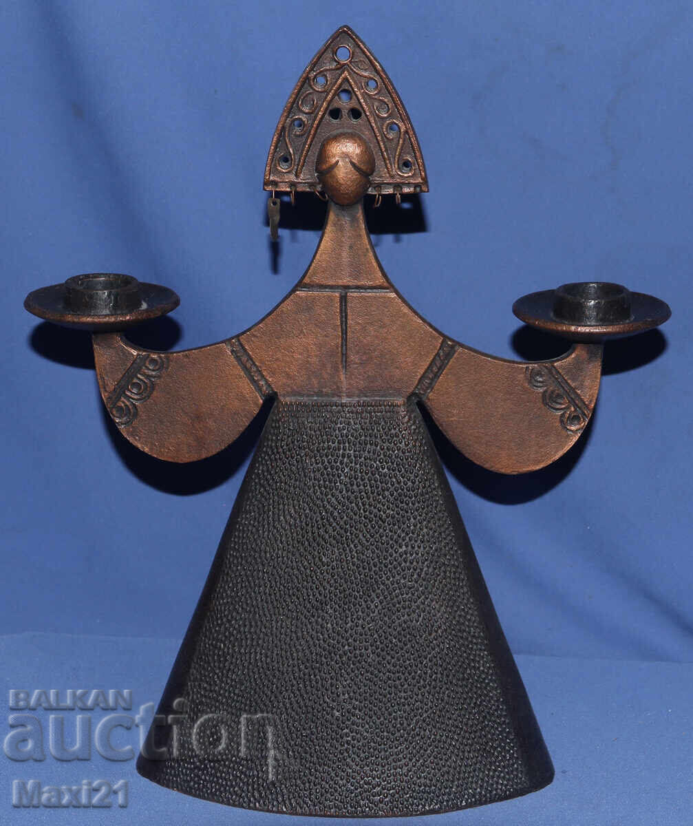 Decorative Russian metal candlestick, woman in traditional costume