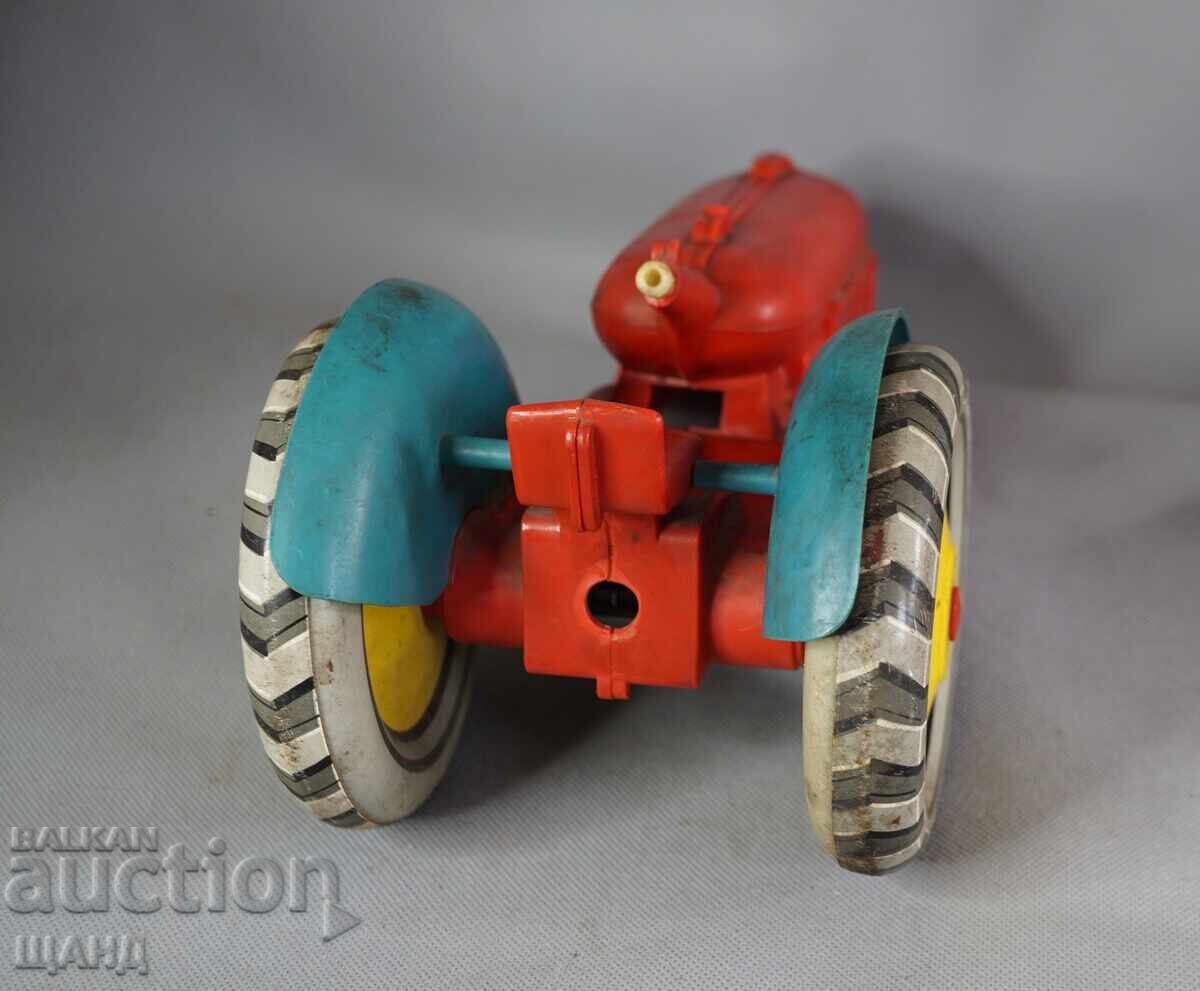 Delivery of Old Russian large plastic toy model tractor
