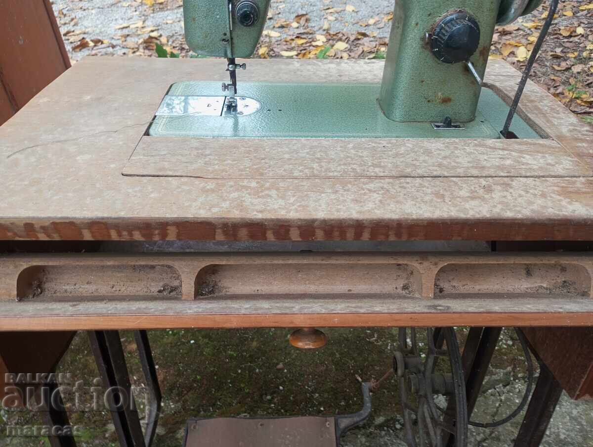 Auction  Old sewing machine with metal legs