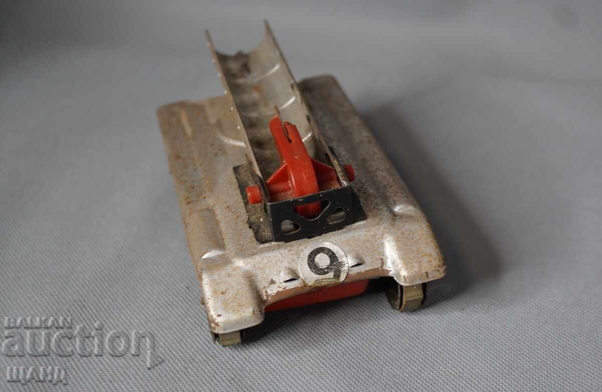 Auction  Old metal mechanical toy model tank missile carrier