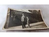 Photo of a Man and a Girl at the Port in front of the Steamer Evdokia