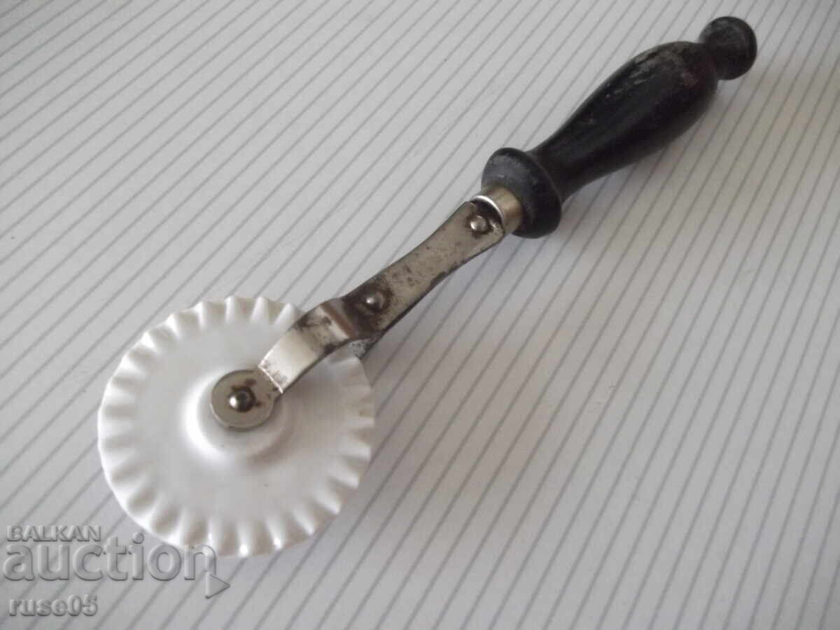 Auction  Dough cutter with porcelain disc and wooden handle
