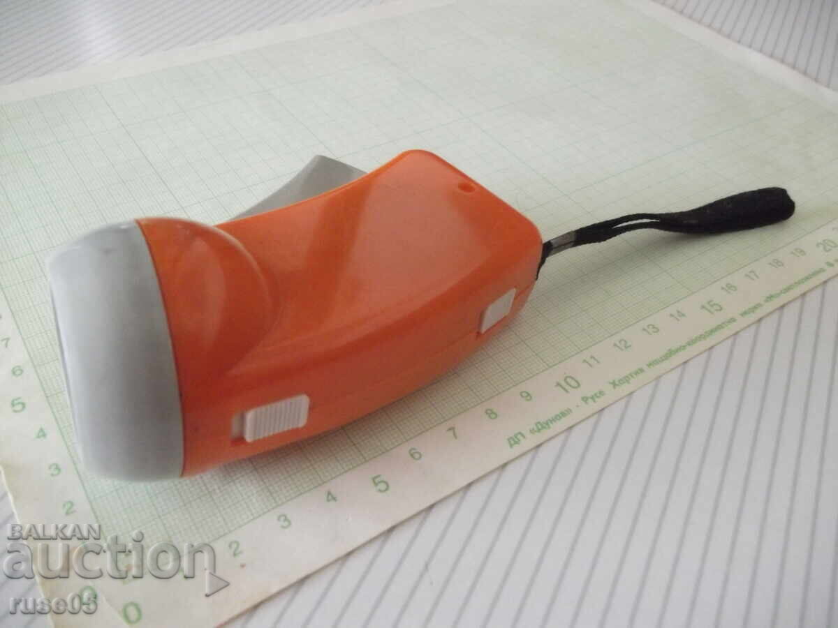 Auction  Dynamo-powered flashlight